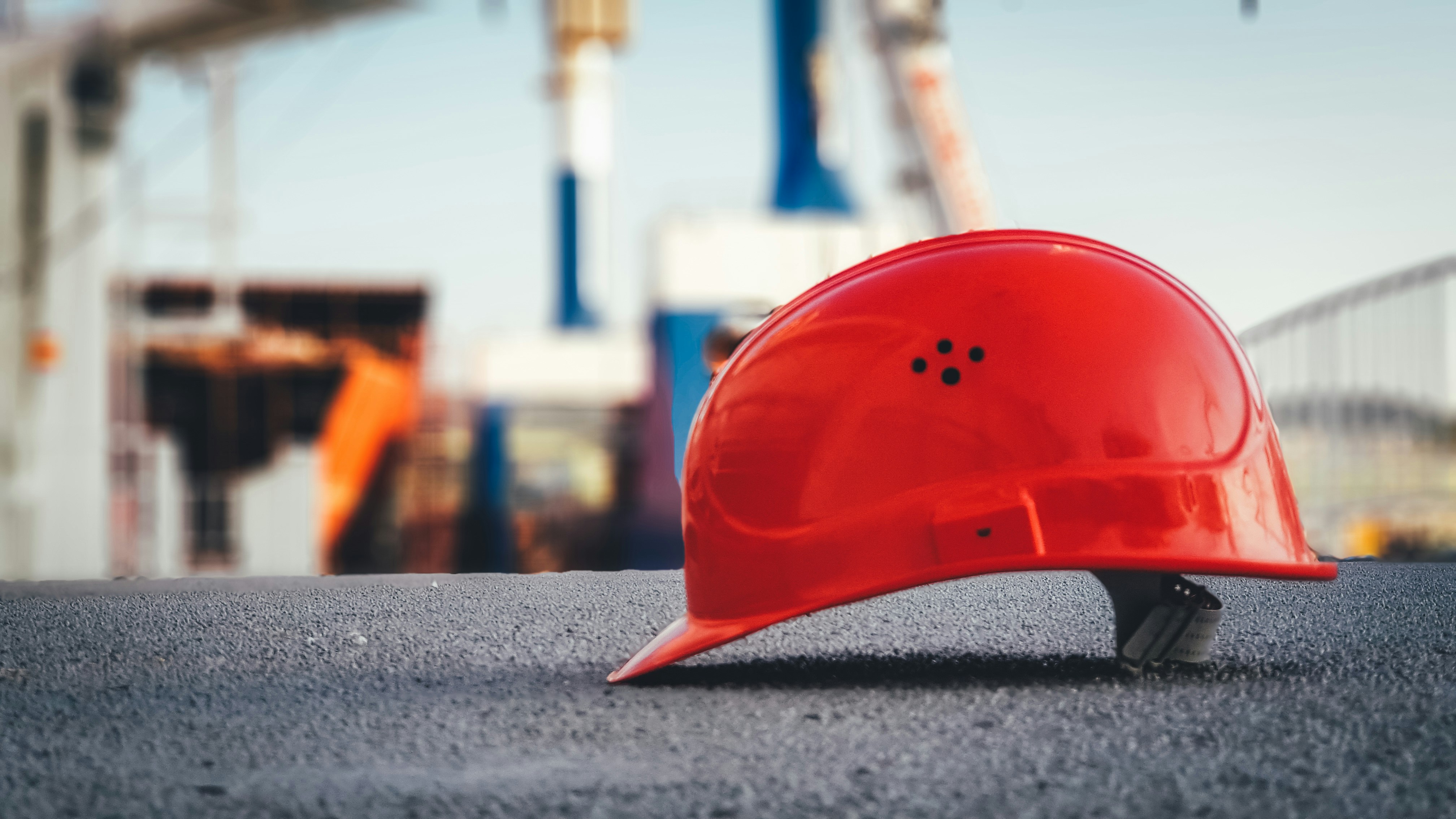 Construction helmet resting on cement brick